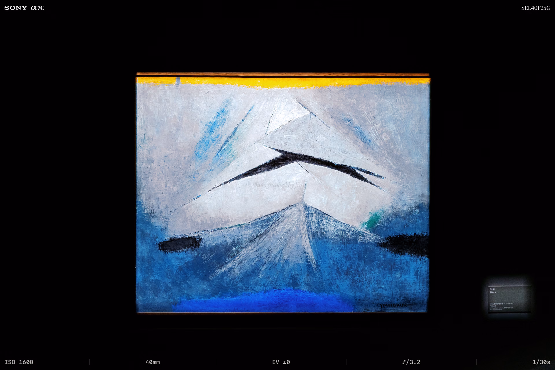 A white peak rising beneath a yellow band