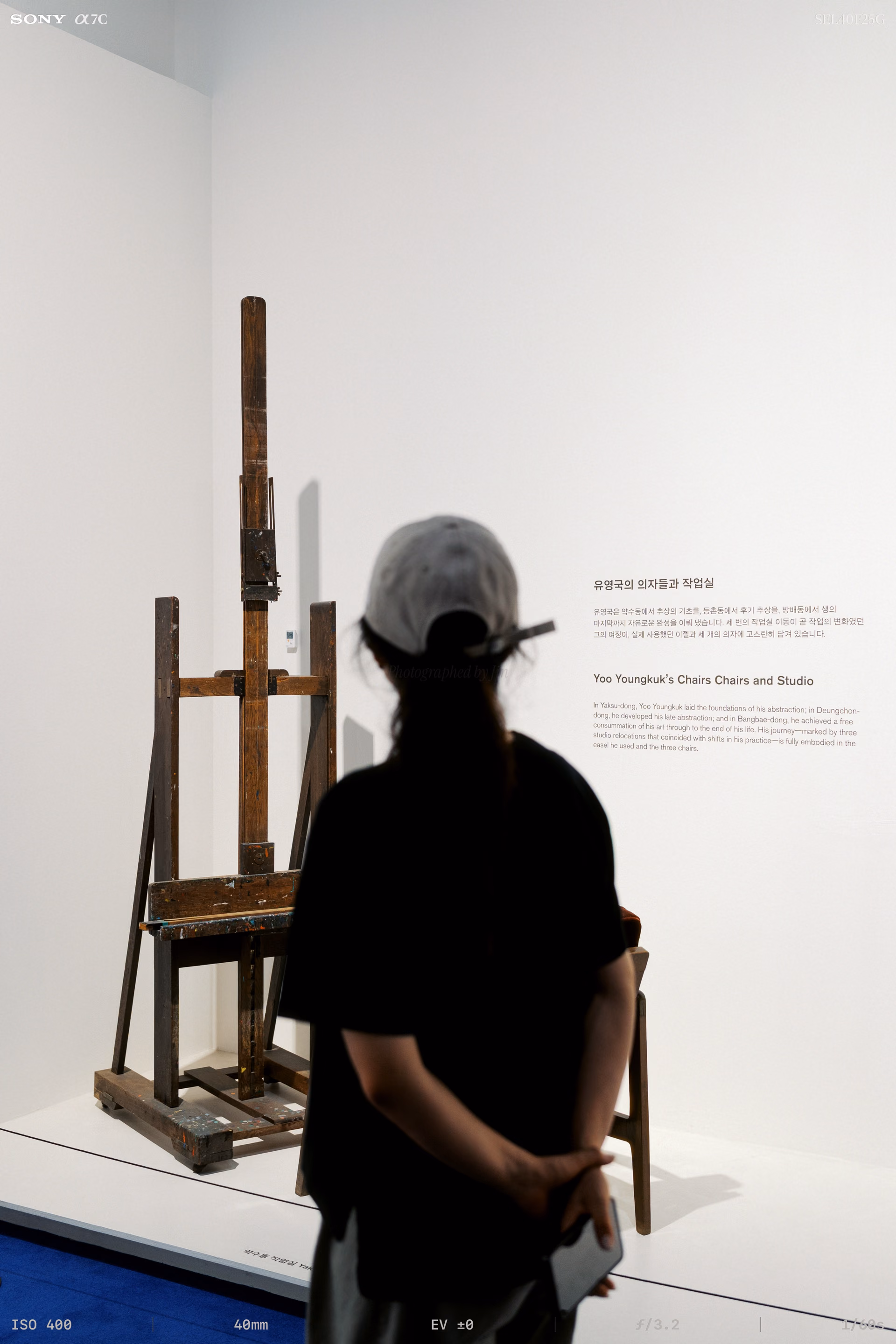A wooden easel and chair crusted with paint