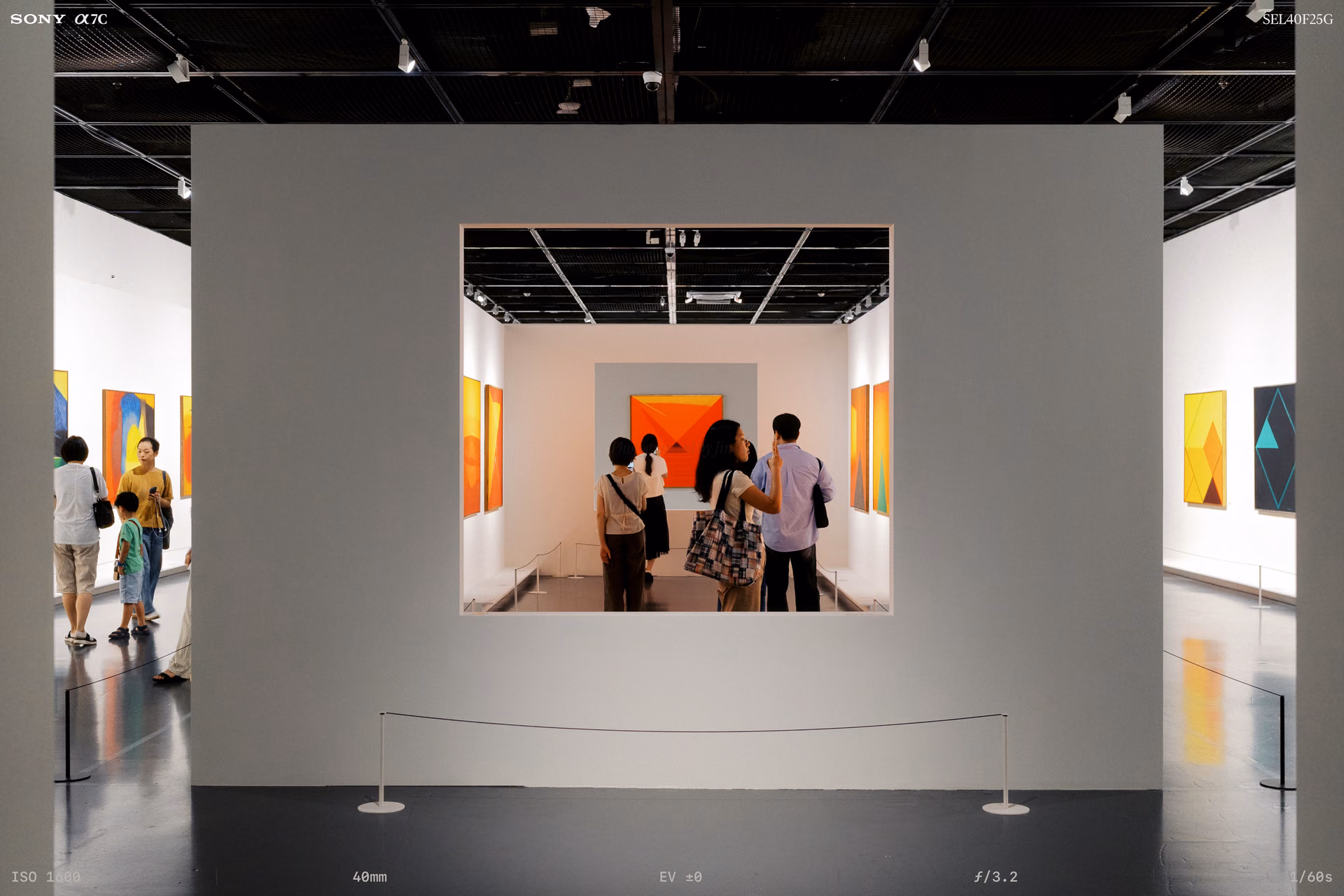 A room seen through a gray wall cut like a window